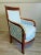 Empire style restoration, armchair Bergère, France circa 1815-1830. Solid mahogany wood with gold leaf details. Fully...
