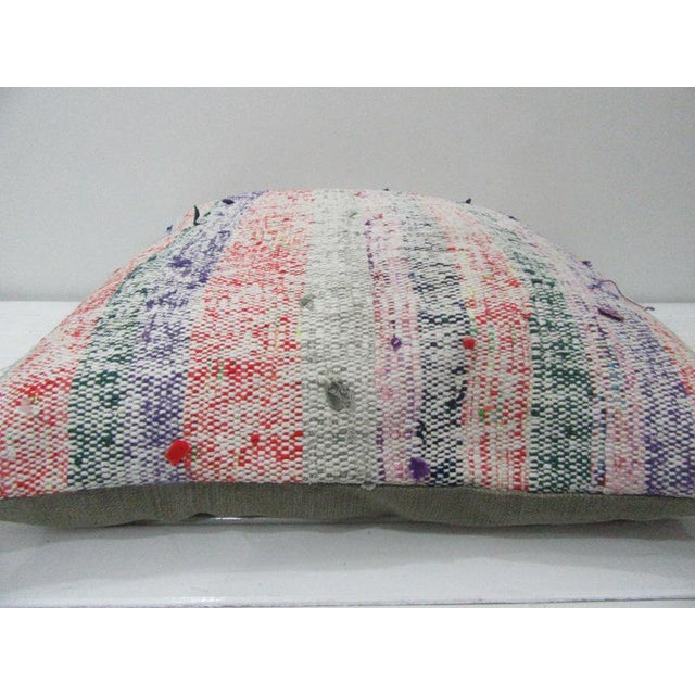 This is a pillow cover made from a vintage kilim rug. The piece was properly washed and ready to use. Pillow inserts not...