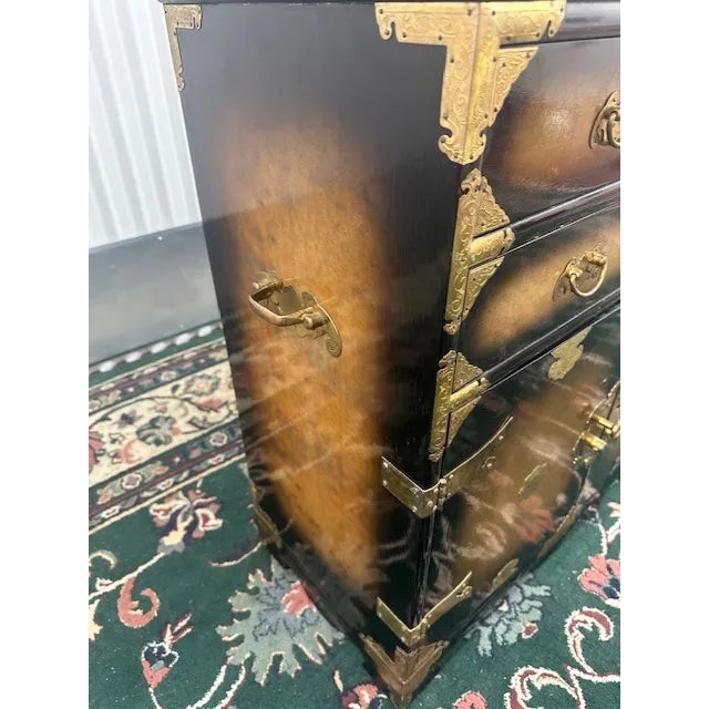 Immerse your space in the epitome of sophistication with our Black & Gold Accent Chest. Crafted with meticulous attention...