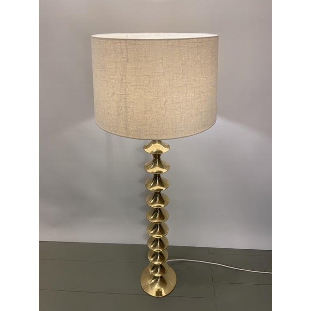 Sculptural floor lamp with a beautiful brass base and fabric shade, by Elite AB, Sweden, 1960s I have official proof of...