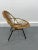 Vintage shell armchair in rattan by Rohe Noordwolde, 1950. Structure in black metal and seat and back in bamboo and...