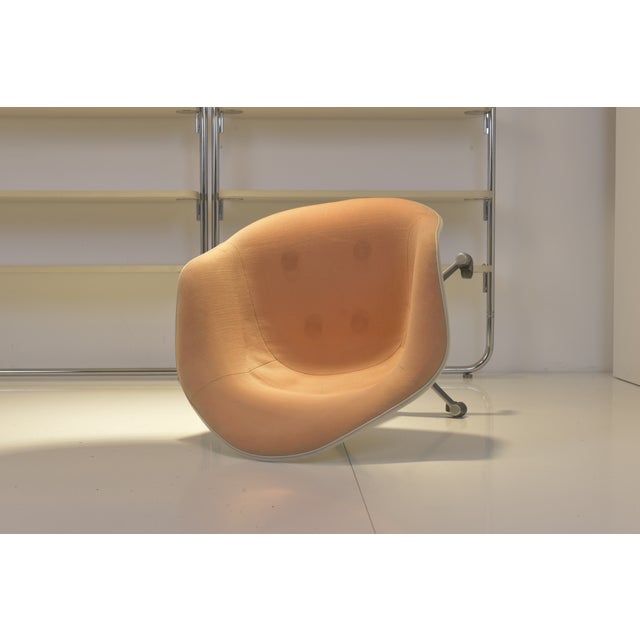 Dining Armchair fiberglass reinforced polyester shell, fully upholstered with base on wheels, turnable. Signed with label...