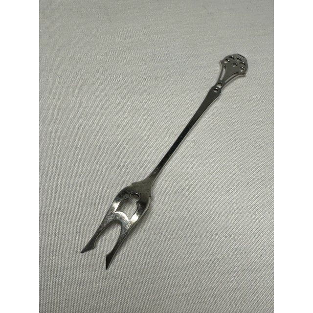 Sterling butter pick by Webster Company. This Massachusetts company began making silver wares in 1869. They are now part...