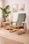 This elegant Scandinavian modern lounge chair is a distinctive example of Danish furniture design from the late 20th...
