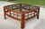 Vintage square coffee table crafted from bamboo and rattan in a rich tortoise finish. The substantial frame features...