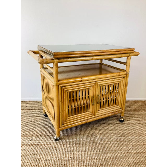 Vintage 1960s Rattan Serving Bar Cart made of rattan natural color black laminate flip top that doubles in size open shelf...