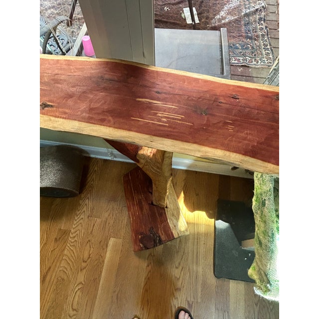 Handcrafted cut sanded and imagined from a recently Fallin cedar tree nearby. Detachable base the stand just fits in...