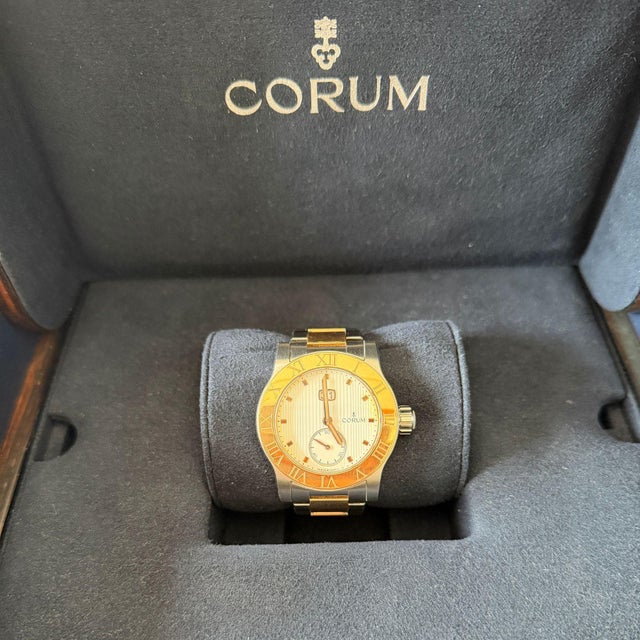 Corum Romulus reference 81251524-V810-EB7 two-tone 18K rose gold and stainless steel automatic watch featuring a champagne...