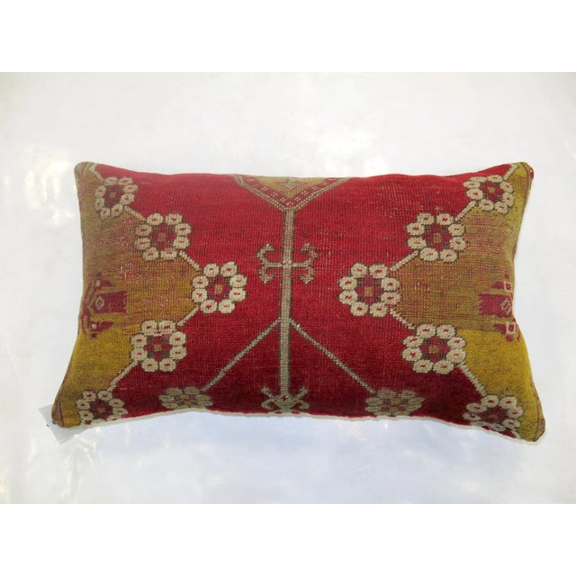 Pillow made from a vintage turkish rug with cotton back. Zipper closure and foam insert provided. 16'' x 27''