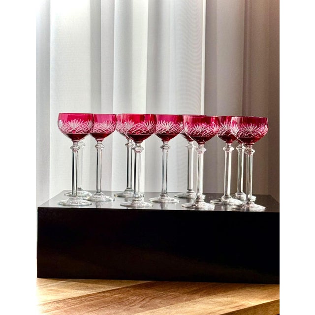 A set of eleven vintage cordial or liqueur glasses in ruby cut-to-clear crystal, attributed to Val Saint Lambert. The...