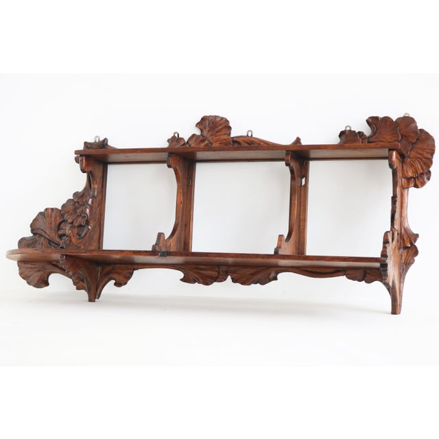 A striking and exceptionally large French Art Nouveau wall shelf, dating to around 1900, beautifully hand-carved from...