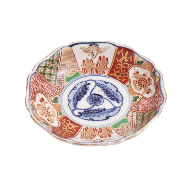 Japanese Imari porcelain footed saucer with under rim and signature in cobalt under glaze blue. The face of the saucer is...