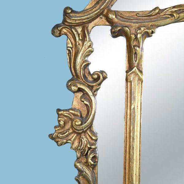A vintage gold Chippendale mirror — pierced fretwork and gilded scrollwork in the classic Chinese Chippendale manner. The...