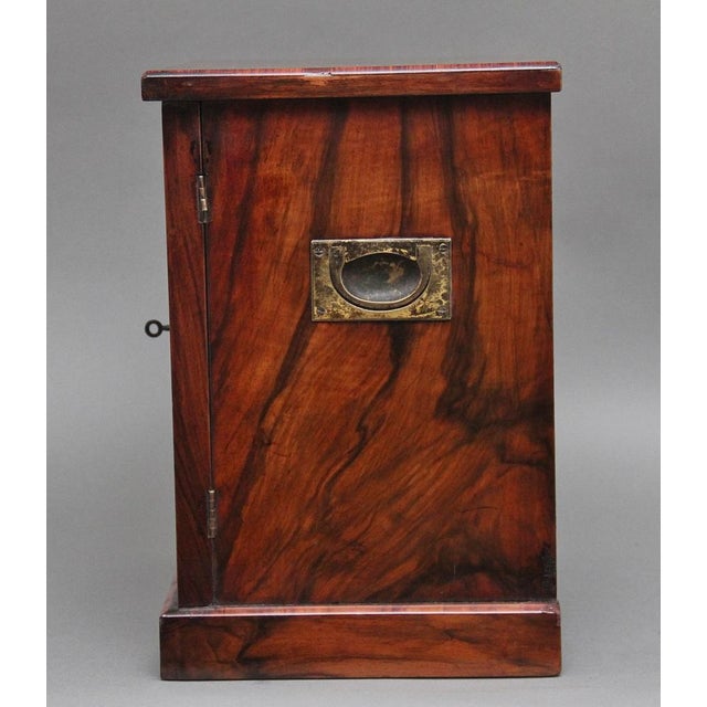 A fine quality 19th Century burr walnut table cabinet, having a nice figured top with decorative inlay along the edge and...