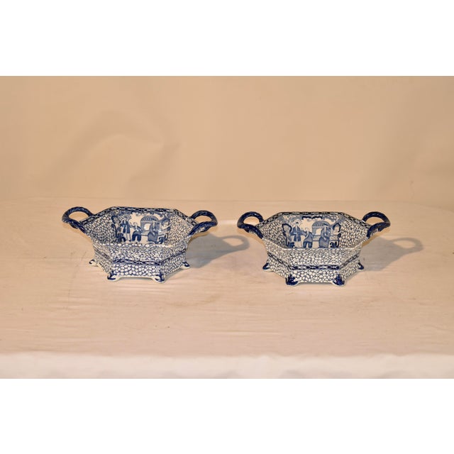 Pair of handled bowls from England in the highly collectible "Chinese Bird" pattern. The pattern has an overall background...