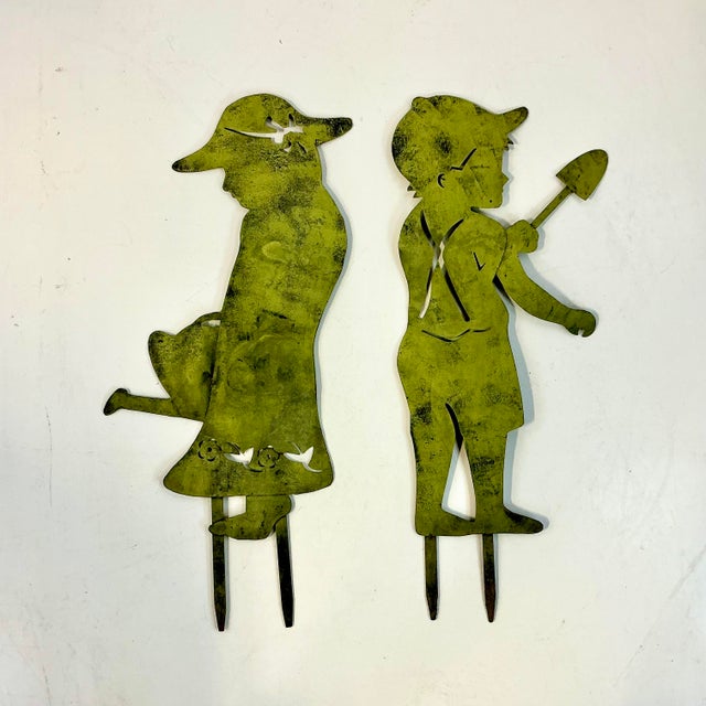 These are from our private collection and curated from France about 20 years ago. The pair of Garden Ornaments have a boy...