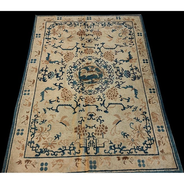 Antique Ningxia Small Scatter Size Wool Beige Rug, Circa Date: 1880s. This exquisite example of late 19th-century Chinese...