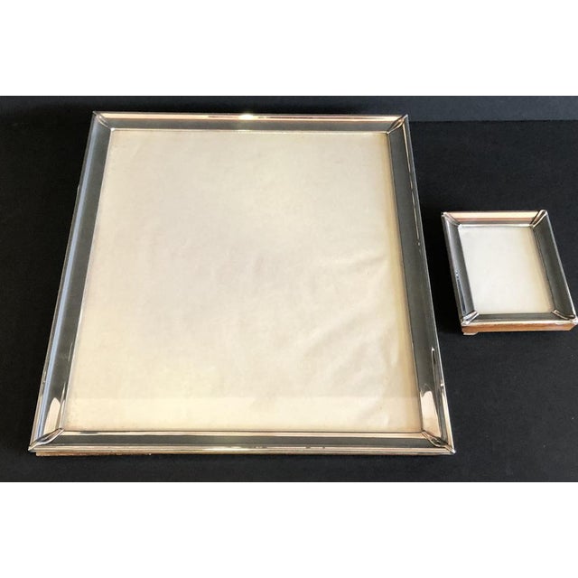 2 photo holders with sterling silver frames of different measurements, same design, measurements of the large one...