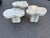 Set of 3 organic-formed tessellated fossil stone cloud nesting tables that form a multi- leveled coffee table. Tables are...