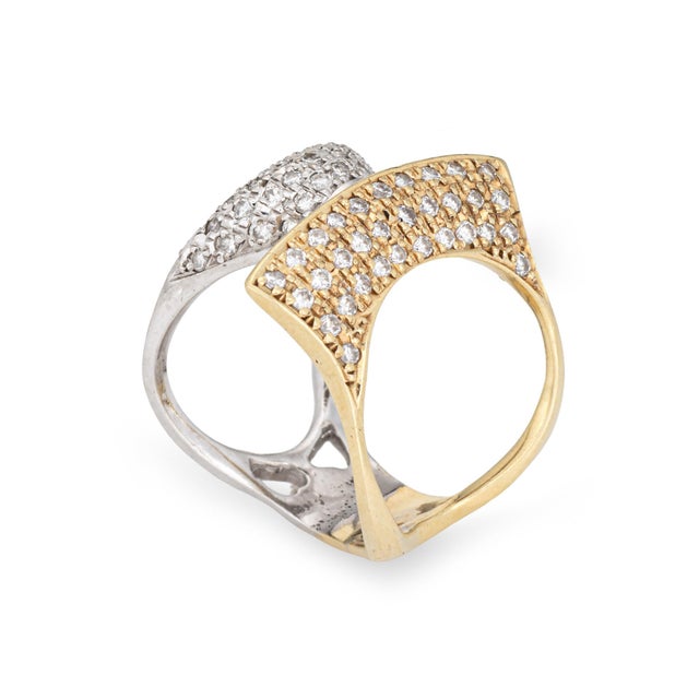 Stylish vintage diamond sculptural ring crafted in 14k yellow gold (circa 1980s). 68 pave set diamonds total an estimated...
