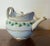 Antique early 19th century Vienna porcelain tea pot decorated with a green ivy garland and gilt monogram. Measures 5 1/4"...
