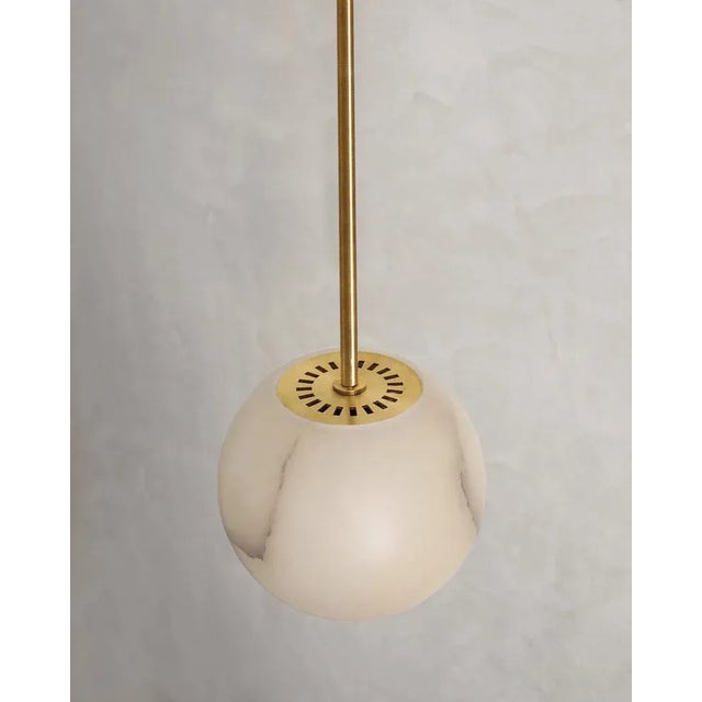 Planette tube 22 pendant by contain dimensions: ø 22 x h 100 cm (custom lenght). Materials: alabaster, brass. Also...