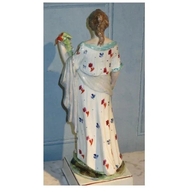 Large antique 19th c. Enoch Wood Staffordshire pearlware figure of Flora. Measures 13 1/2" tall. The classical maiden...
