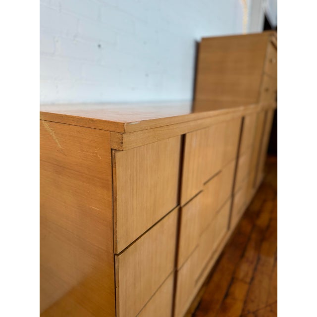 Set of matching MCM Johnson Carper dressers in classic glossy birch finish. Total of 11 roomy drawers, all of which...