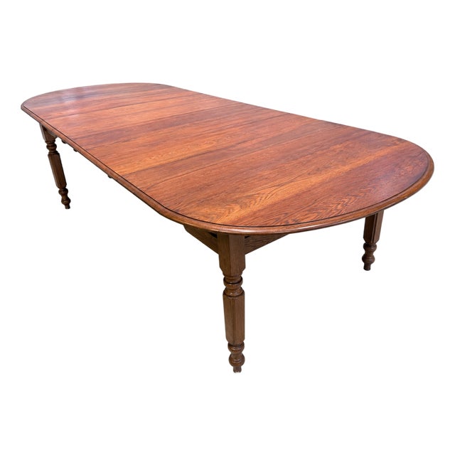 Antique Solid Oak Extension Dining Table With 6 Original Leaves & Original Wooden Casters Circa 1940s–1950s For Sale