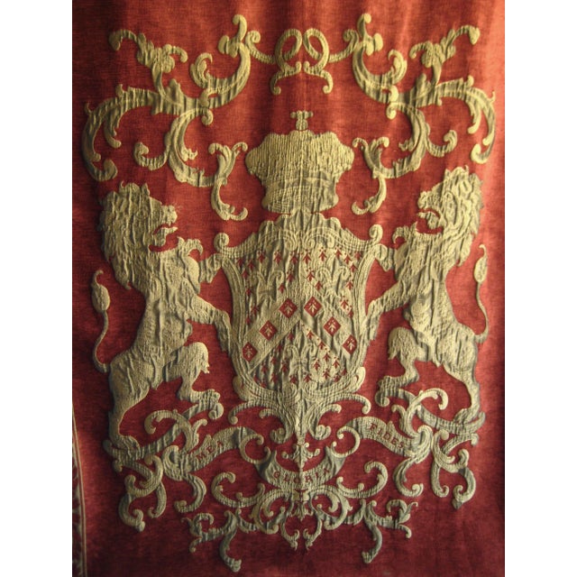 This impressive coat of arm woven tapestry present an imposing royal crow surrounded by two large gold lions , the piece...
