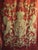 This impressive coat of arm woven tapestry present an imposing royal crow surrounded by two large gold lions , the piece...