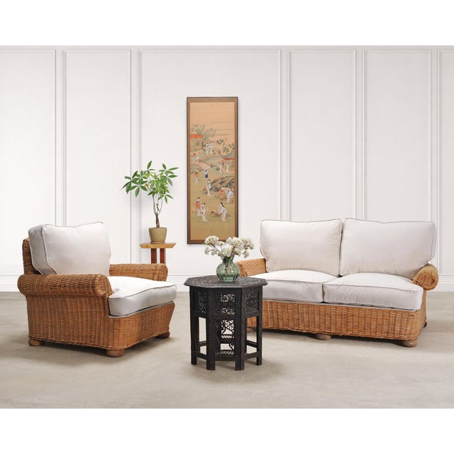 A beautifully crafted lounge chair and matching settee living room suite, handwoven in natural rattan wicker over a...