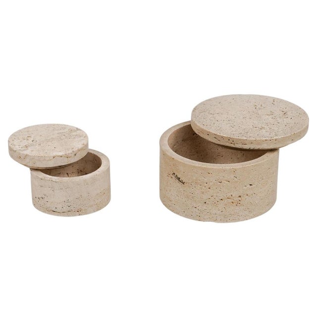 Midcentury pair of cylindrical decorative box in travertine in the style of Enzo Mari. Made in Italy in the 1970s. Large...