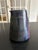 A glazed ceramic pitcher, circa 1950-1960, with a simple, modernist design. It features a graphic decoration composed of...