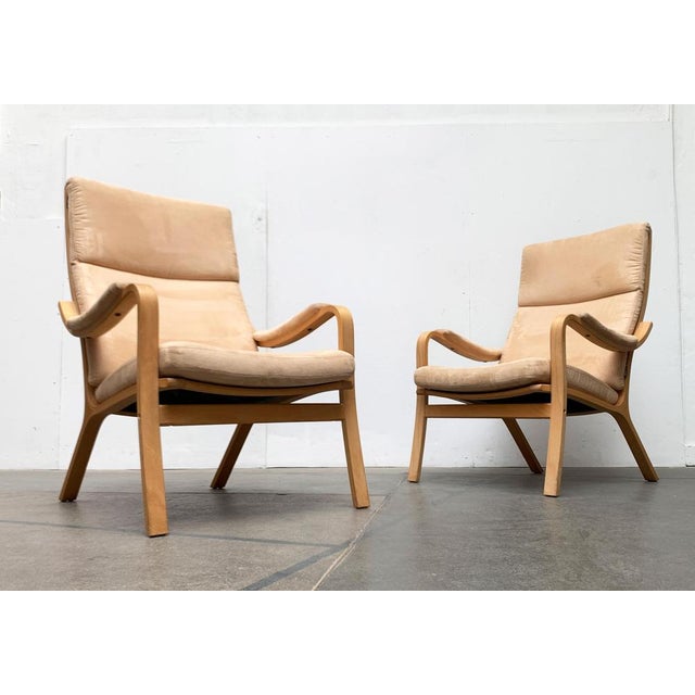 Elegant Easy Chairs with armrests from the Danish manufacturer Skalma. The elegantly curved frame of the armchair is...