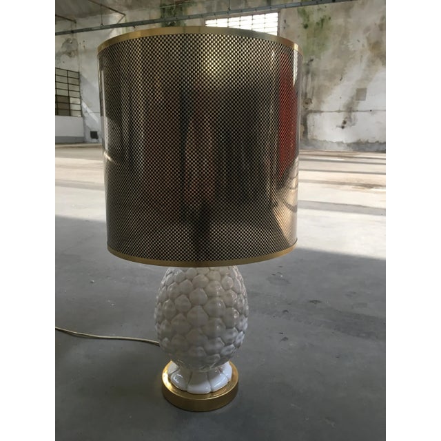 This Italian pineapple shaped table lamp features a ceramic base with an acrylic lampshade and dates from the 1970s....