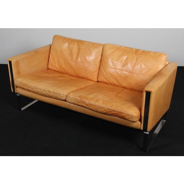 Hans J. Wegnr two seat sofa in original patinated nature leather. Frame of stainless steel\. Model Ch102, made by Carl...