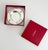A sophisticated silver-plated catchall or ashtray by Cartier. The rim features fluted rests and two vivid blue lapis...