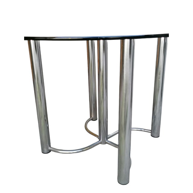 Round Table in Steel and Black Glass by Giotto Stoppino, 1970s, in Flawless conditions. Designed 1970 to 1979 This piece...