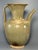 This antique Chinese celadon ewer features elegant spout and curved handle, with natural aged patina on the glaze. A fine...