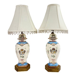 Mid 20th Century Pair of Vintage Hand Painted Porcelain Table Lamps With Lion Crest and Brass Base For Sale
