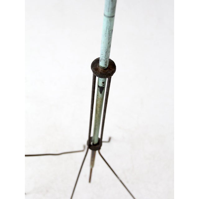 This pair of antique lightning rods dates to the late 19th century and features wrought iron tripod bases with twisted...