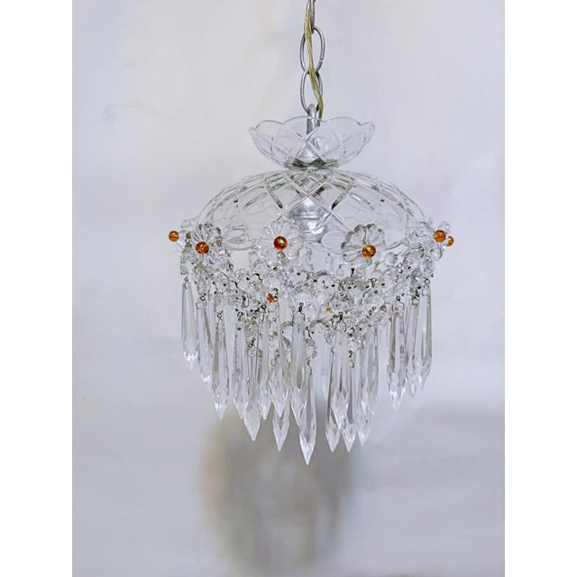 Infuse your space with whimsical vintage charm and romantic elegance with this unique crystal basket chandelier. Moving...