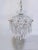 Infuse your space with whimsical vintage charm and romantic elegance with this unique crystal basket chandelier. Moving...