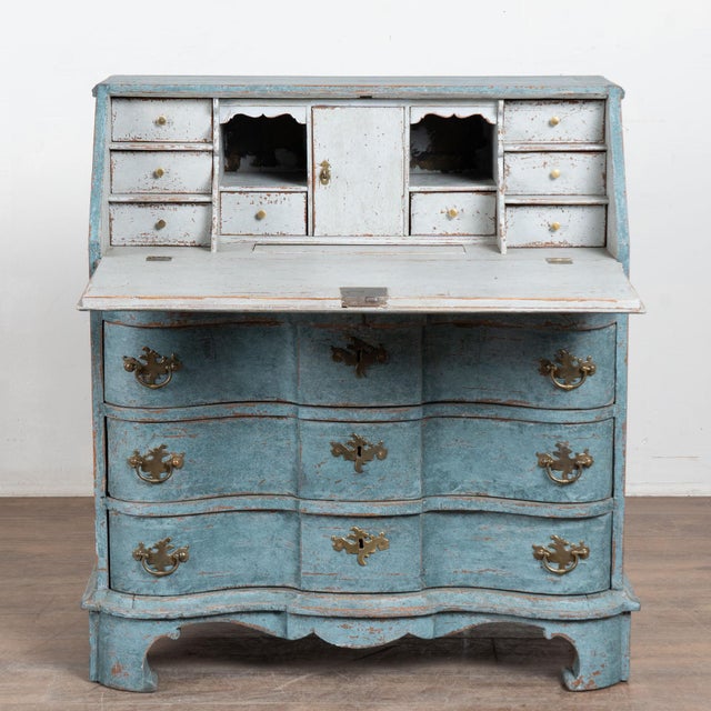 This oak rococo secretary reflects the grace and class of European styling in the early 1800's. The dramatic serpentine...