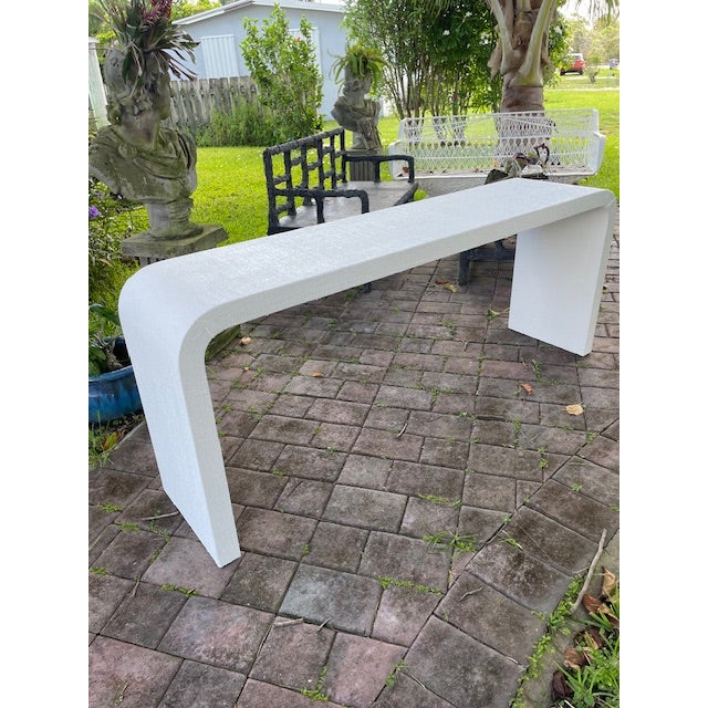 Karl Springer Style 1970s White Satin Acrylic Waterfall Console Table Elegant and sculptural, this 1970s waterfall console...