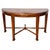 A striking Neoclassical demilune console table with a beautiful, rich wood grain finish and gold leaf accents. Features a...