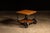 Contemporary oak and steel rolling side table. This industrial-inspired piece features two golden oak shelves for storage...
