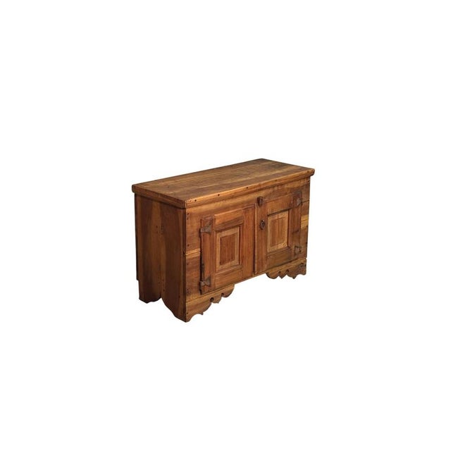 An elegant 19th-century low sideboard crafted from fine solid walnut, it features understated lines, harmonious...