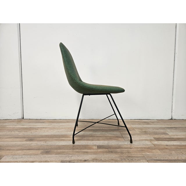 Aster chair by Augusto Bozzi for Saporiti Italia, entirely upholstered in forest green fabric with an iron frame and brass...